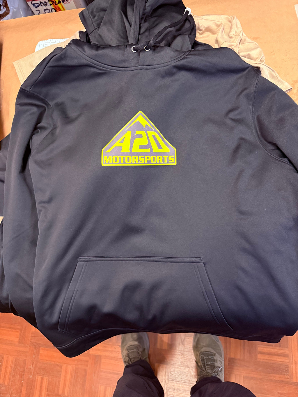 A2D Motorsports hoodie in black with neon green mountain logo and front pouch pocket