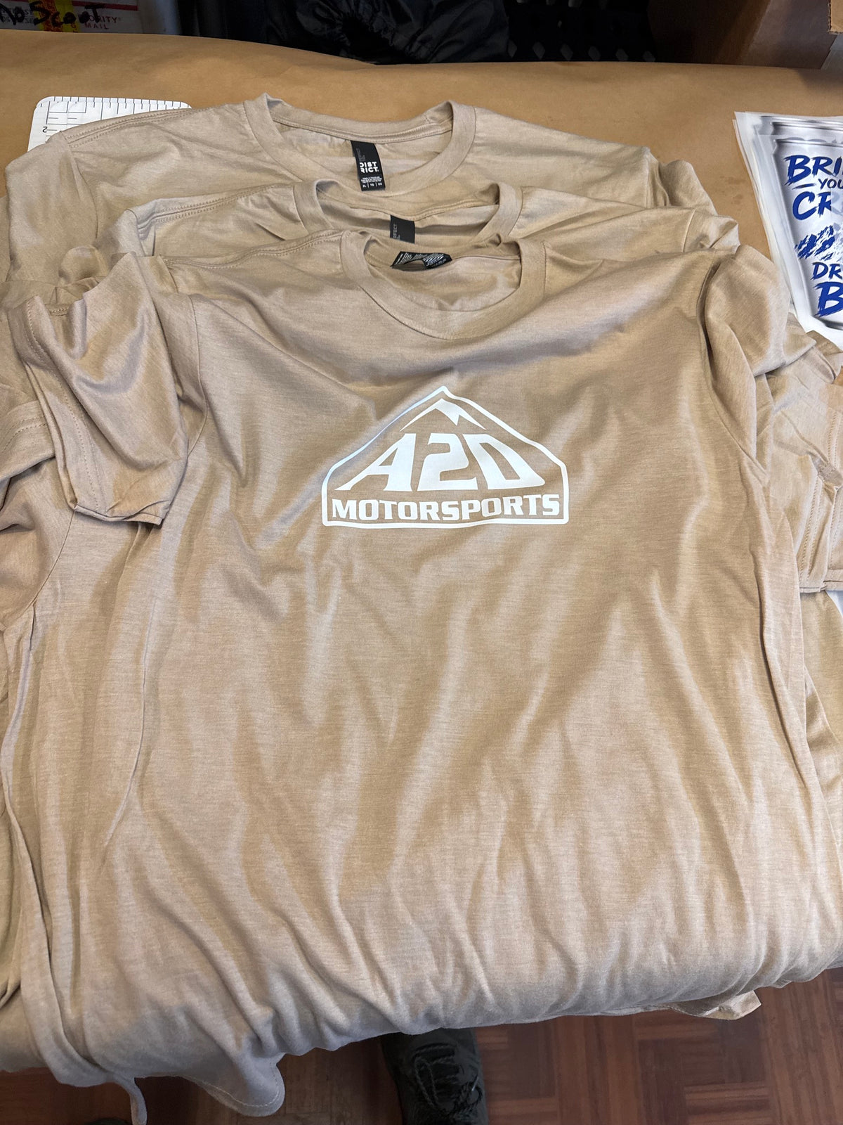 A2D Motorsports t-shirt in sand with white mountain logo