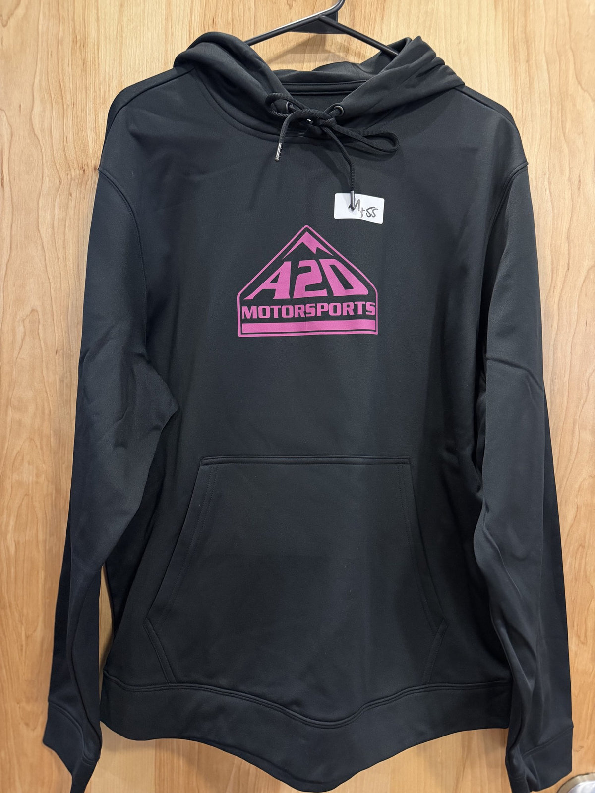 A2D Motorsports black hoodie with pink mountain logo, hanging