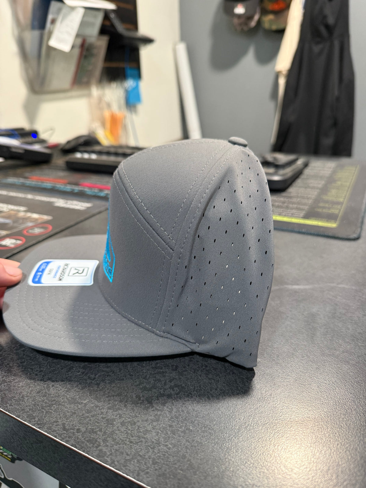 Side view showing laser-perforated venting on the A2D Richardson Performance hat