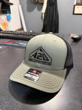 A2D Motorsports trucker hat, loden green with black mesh back and black embroidered mountain logo, Richardson 112