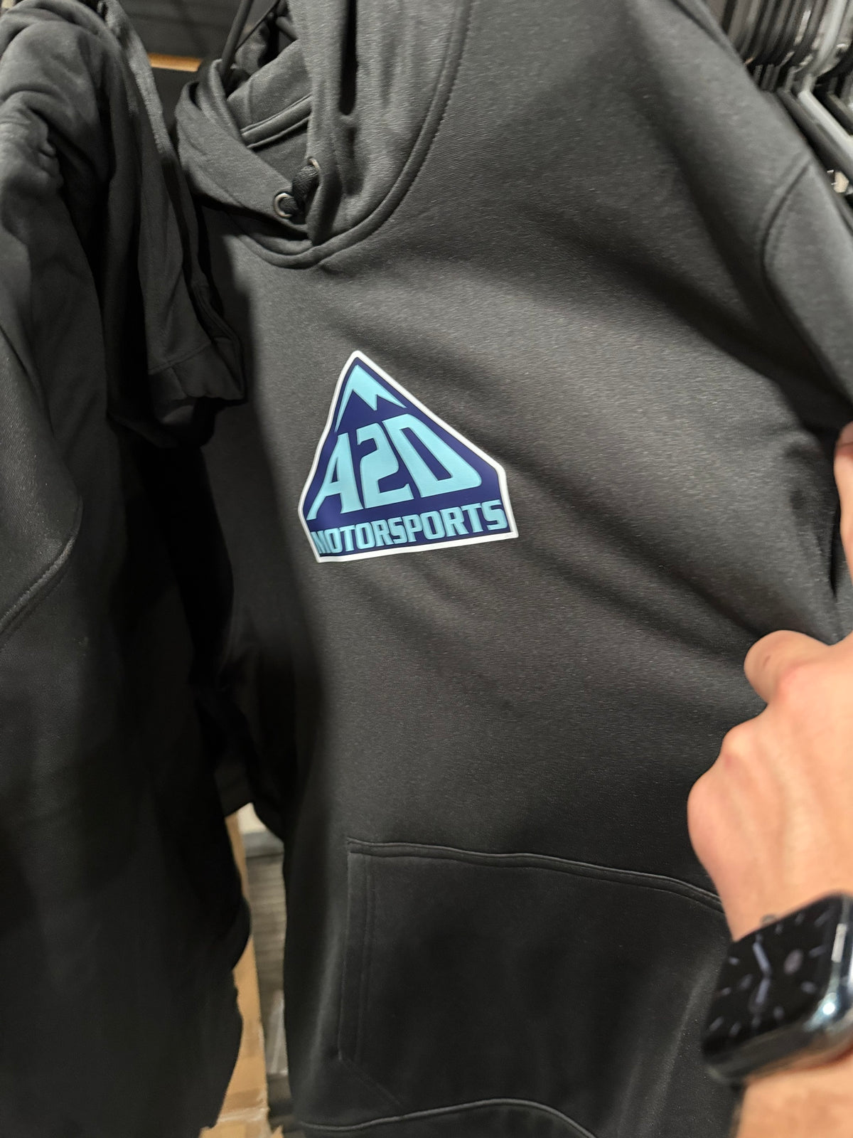 A2D Motorsports black hoodie with two-tone blue mountain logo