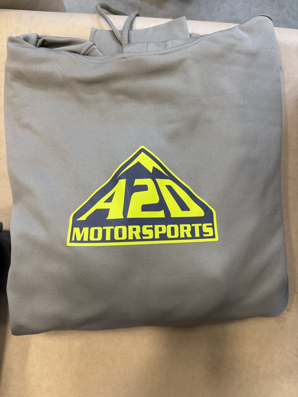 A2D Motorsports sand hoodie with the lime squeeze mountain logo