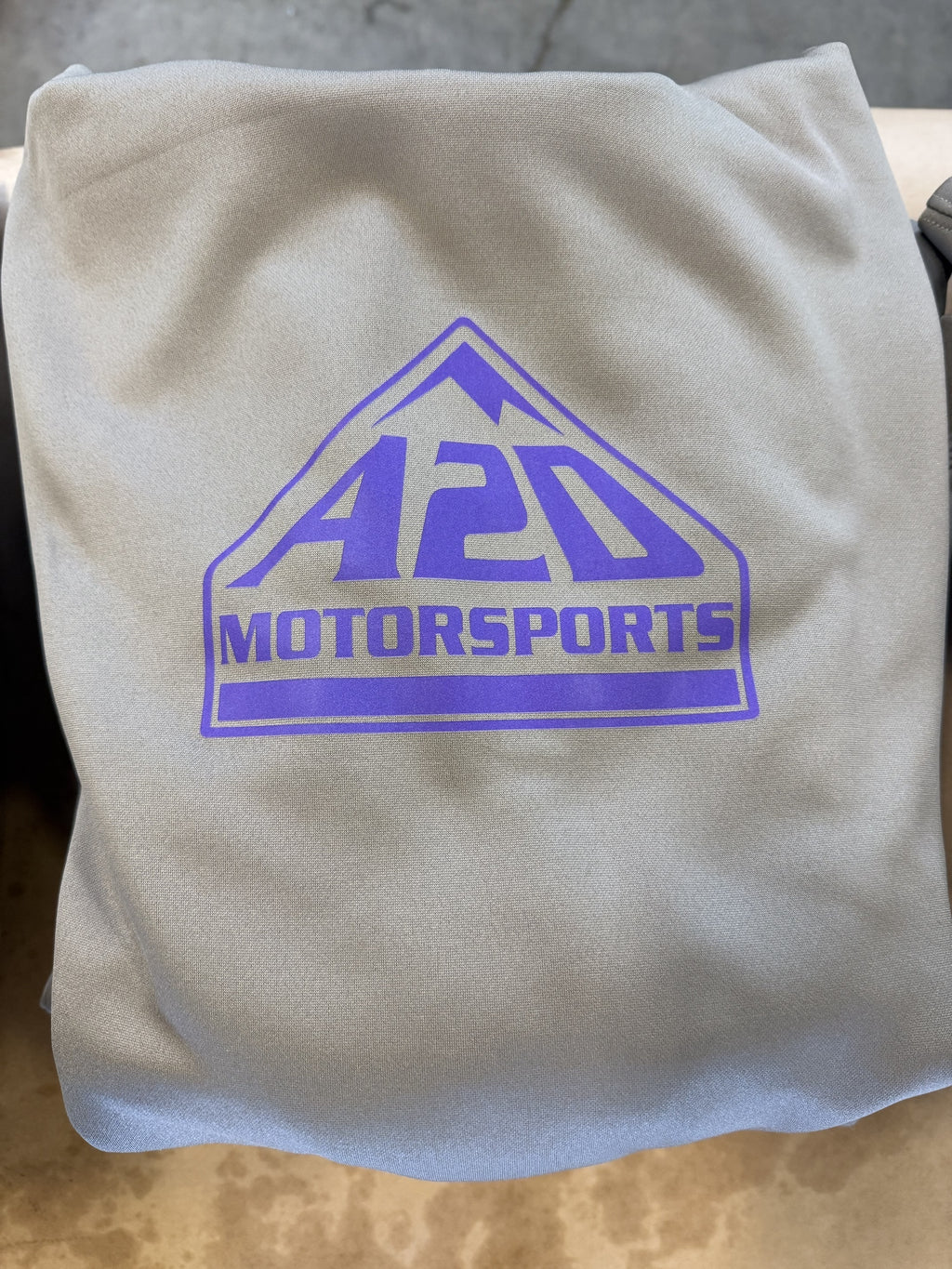 A2D Motorsports sand hoodie with the purple mountain logo