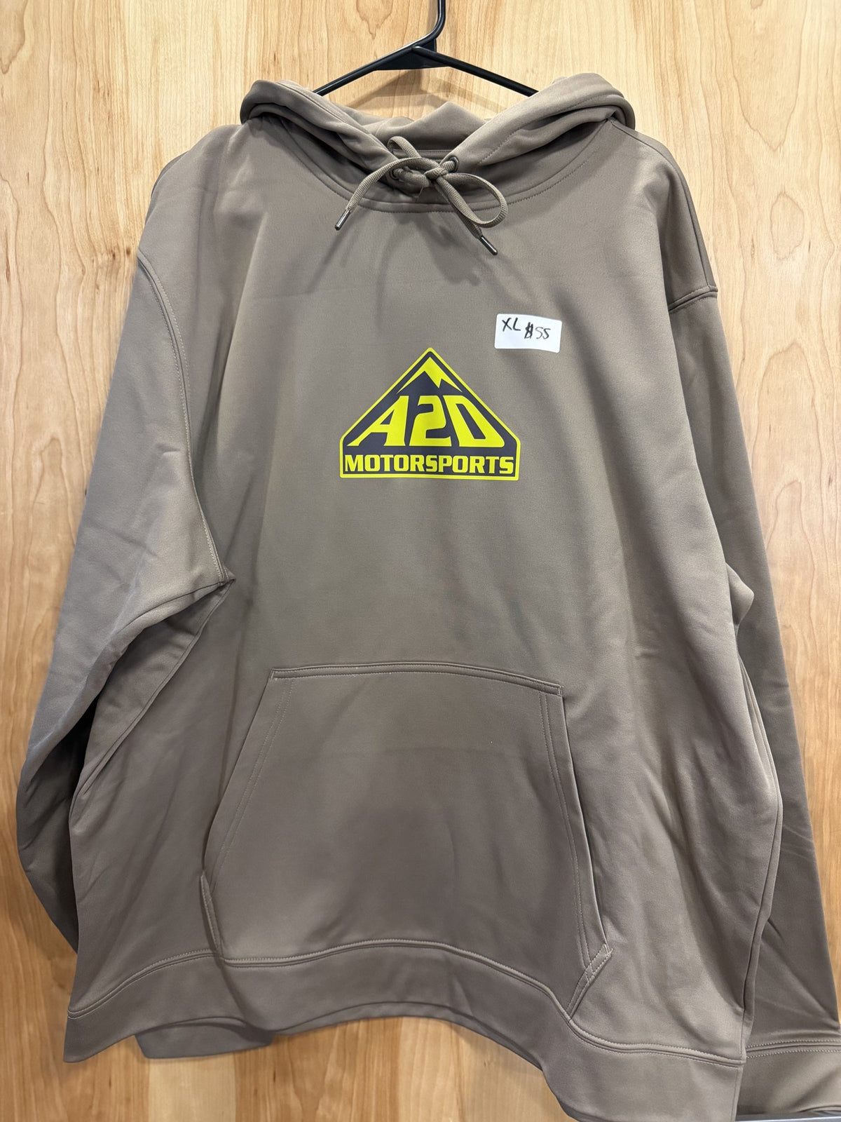A2D Motorsports sand hoodie with lime squeeze mountain logo, hanging