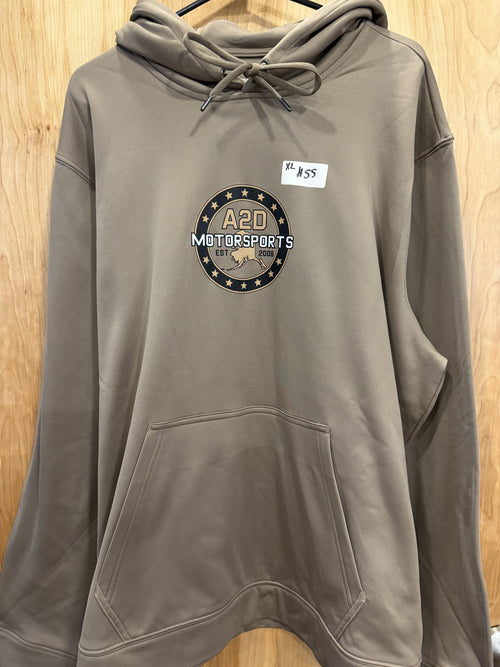 A2D Motorsports sand hoodie with gold and black Stars and State Alaska logo, hanging